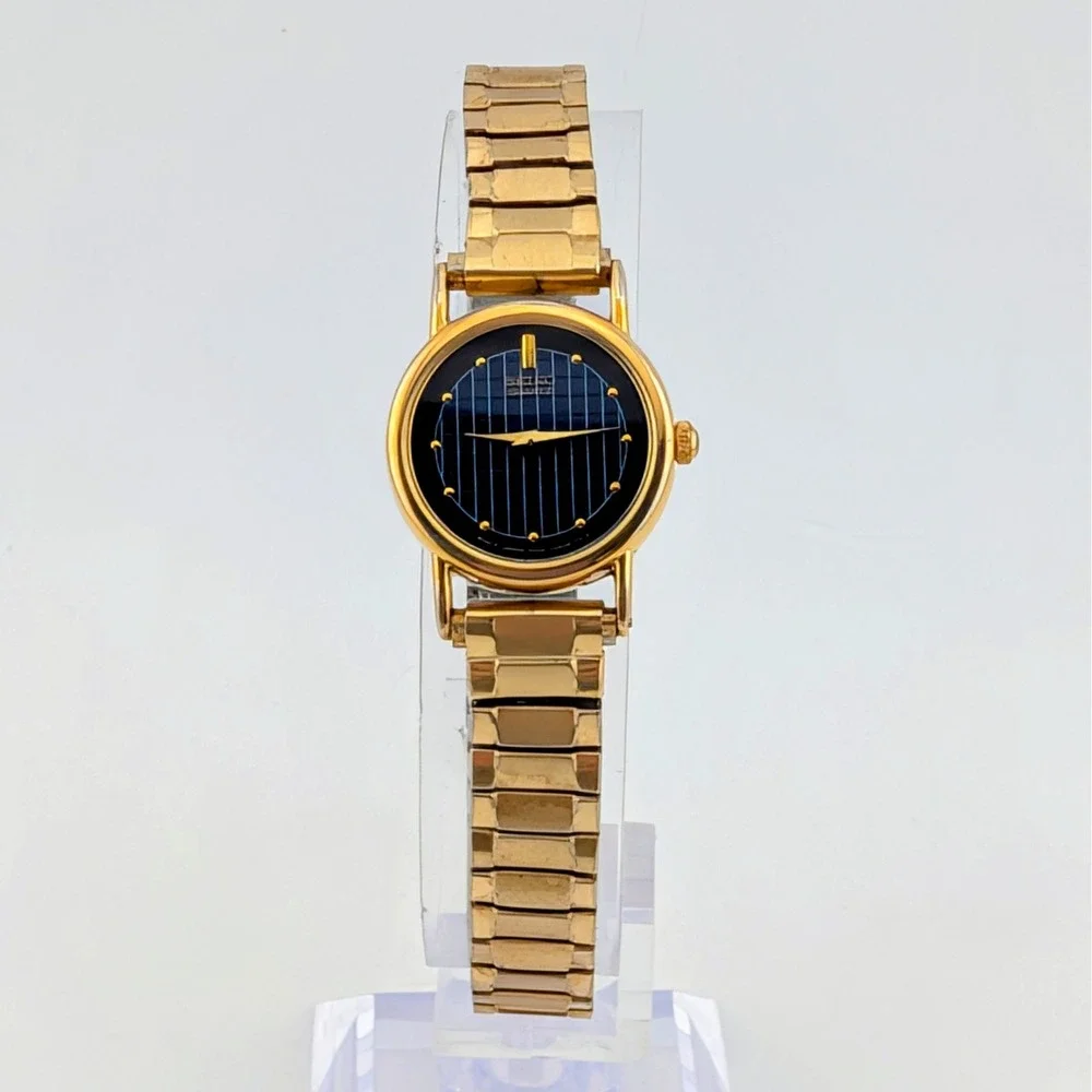 Vintage Seiko 1N00-0F60 Blue Woven Grid Textured Dial Gold Tone Watch 20mm